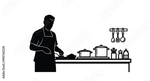 Chef preparing food at a kitchen counter striking black silhouette