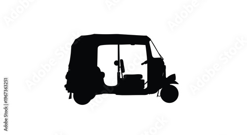 A dark silhouette of a three wheeled auto rickshaw vehicle silhouette