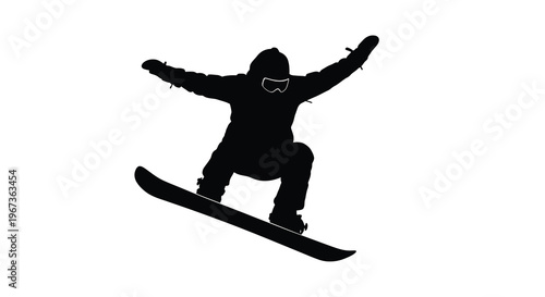 Snowboarder mid air with arms raised a striking black silhouette