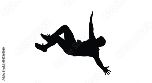 A dynamic falling figure captured in stark black silhouette