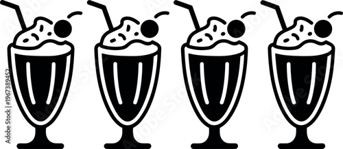 Four milkshakes with whipped cream and cherries