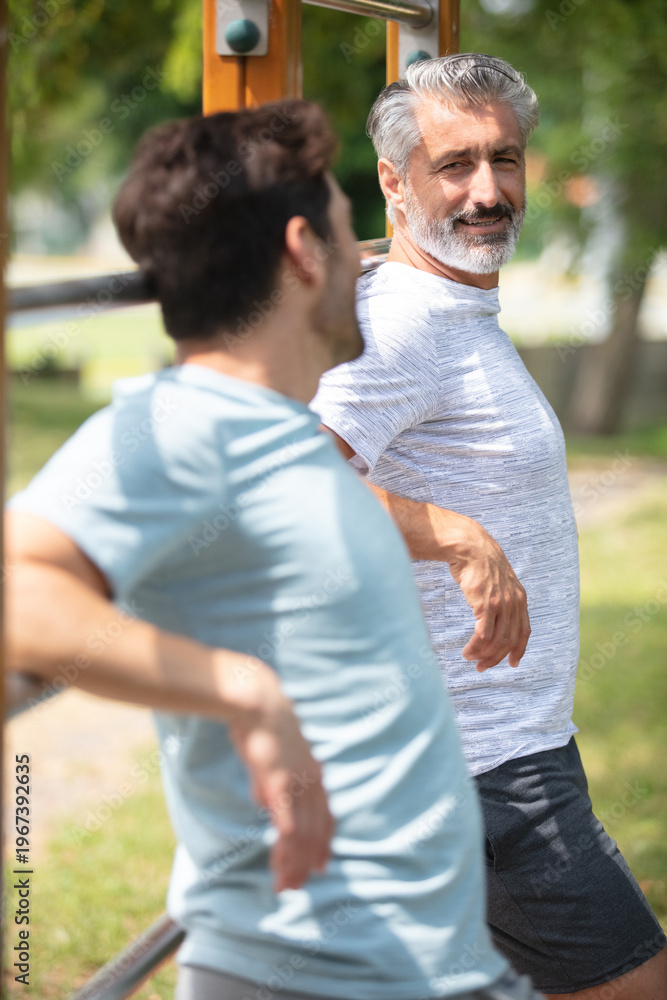 Fototapeta premium two man runners standing talking after running