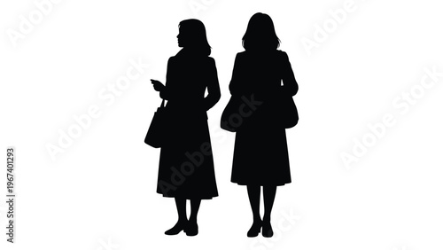 Silhouette of two women standing closely together one holding a phone