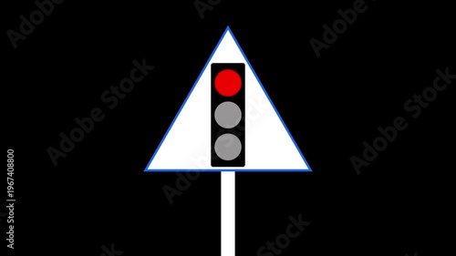 The bottom red light is illuminated on this traffic signal while a red stop sign is visible on the right side.. 4K video,,.......