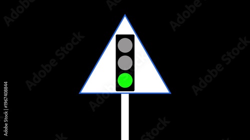The bottom green light is illuminated on this traffic signal while a green go sign is visible on the right side. 4k video,.......,..