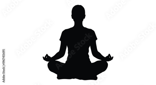Woman meditating in lotus position a striking dark silhouette