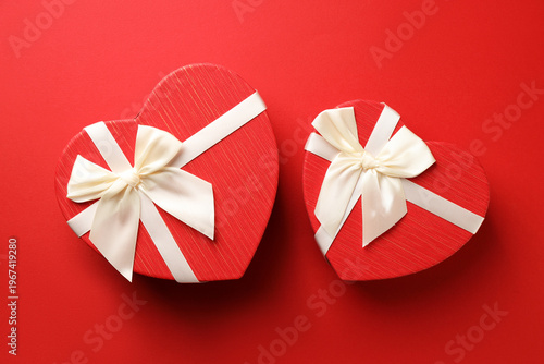 Beautiful heart shaped box on red background, flat lay