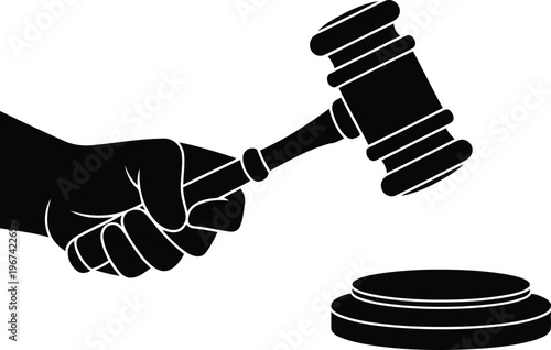 Hand holding a gavel over a sound block