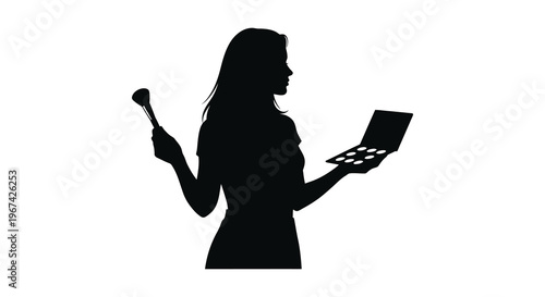 Woman applying makeup and using laptop a striking silhouette