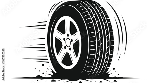 A tire spinning rapidly with motion blur indicating high speed movement and debris flying off.