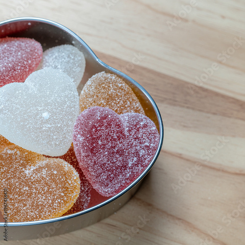 sugared heart candies gathered in a metal bowl, radiating playful sweetness, soft texture, and cozy nostalgic charm