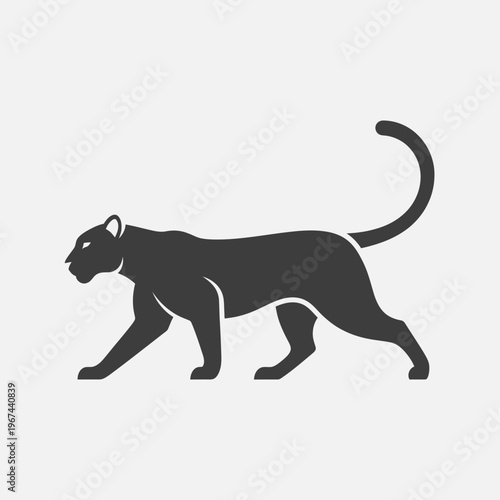 Silhouette of a sleek black panther walking gracefully across the frame.