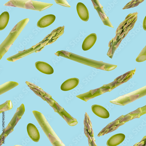 Seamless pattern with fresh green asparagus on colored background. Vegetable texture for packaging.