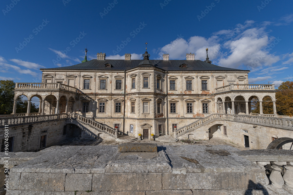Fototapeta premium Renaissance Pidhirtsi Castle with dramatic storm clouds in Ukraine