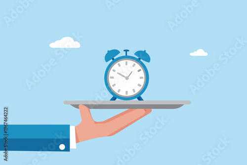 Time is served a blue alarm clock presented on a hand and tray