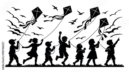 Silhouettes of joyful kids running on the grass, flying kites in the blue sky while birds soar above them