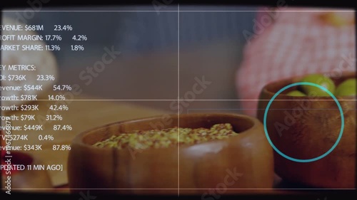 Displaying three wooden bowls, central olive bowl, soft HUD on wood table showing cyan marker