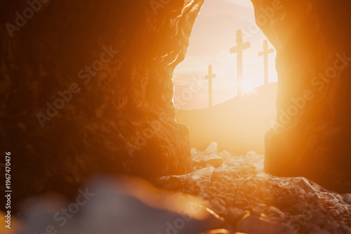 powerful depiction of the empty tomb of Jesus Christ at sunrise. The view from inside the dark cave opens to a bright morning sky with three crosses on the distant hill of Golgotha. Good friday