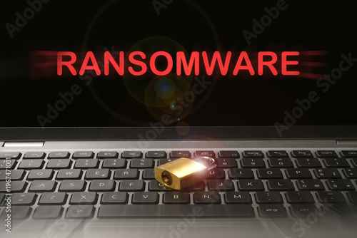 Computer security concept with a closed padlock on the laptop keyboard and 