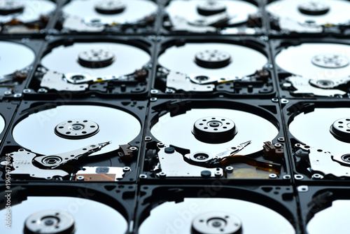 Group of hard disk drives. Many Open Hard drives. Close-up of the inside of PC hard drives. Technology background. Selective focus