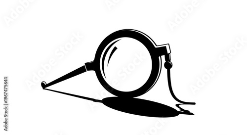 Monocle with handle and cord, black and white illustration.
