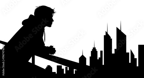 Silhouette of a person looking at a city skyline.