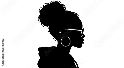 Silhouette of a stylish woman with a bun and glasses.