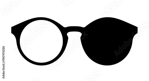 Stylish round glasses with one lens clear and the other completely blacked out.