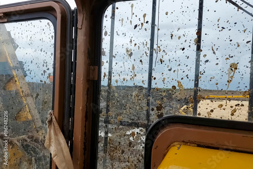 Dirt stained pipelayer cab windows while laying a gas pipeline i
