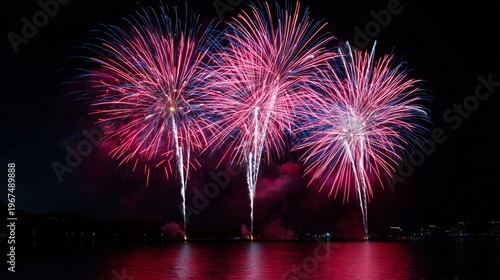 Fireworks Display Over Water During Night Celebration