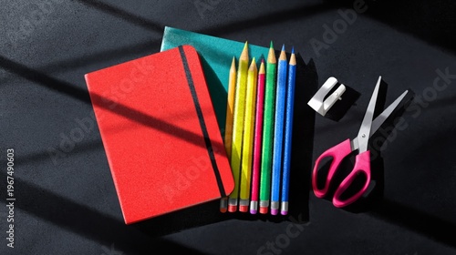School Supplies on a Desk With Colorful Pencils and an Apple Near Books and a...
