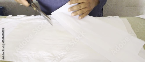 Younge Asian Tailor Men Working video.