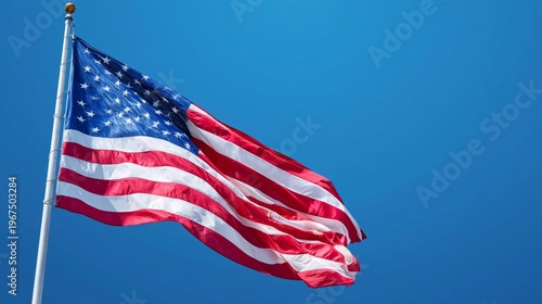 Waving Flag of the United States Against Clear Blue Sky With Bright Sunlight ...