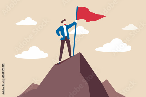 A man triumphantly plants a red flag atop a mountain peak