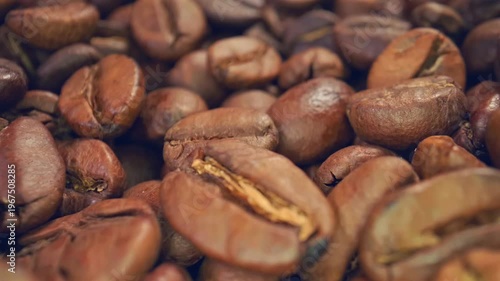 Roasted coffee beans close-up, slow motion, top view