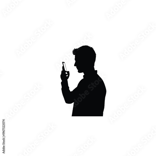 Silhouette of a man using a smartphone with a focused expression with grey background with social media