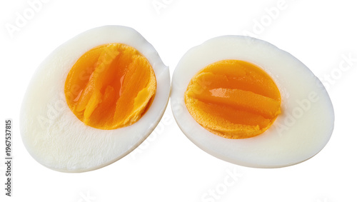 Tableau sur toile Two halves of a hard-boiled egg showing bright orange yolk, isolated on transpar
