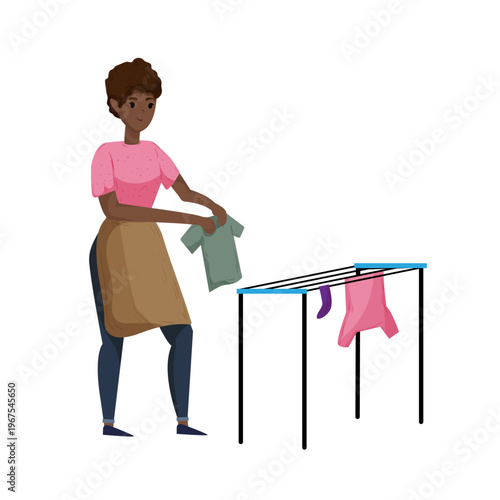 Cartoon vector illustration of a woman hanging clothes on a drying rack. Flat style laundry and home care concept isolated on white background.