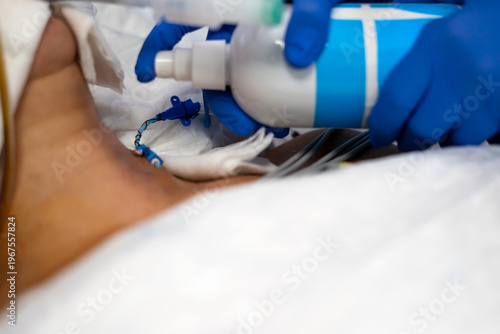 Medical professional managing patient tracheostomy tube ventilation