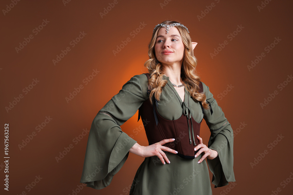 Obraz premium Portrait of beautiful elf girl on brown gradient background, space for text