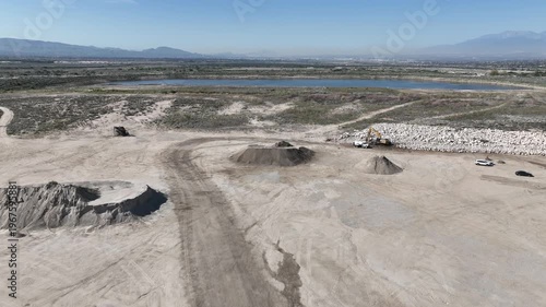  A Man Flying his UAV to survey the local earthquake faults looking at the San Andreas Fault Area near the Seven Oaks Dam, Marks Field,  and the Mentone Quarry 