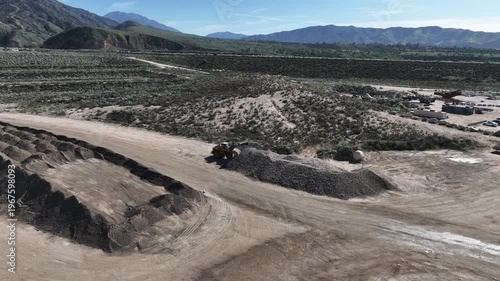  A Man Flying his UAV to survey the local earthquake faults looking at the San Andreas Fault Area near the Seven Oaks Dam, Marks Field,  and the Mentone Quarry 