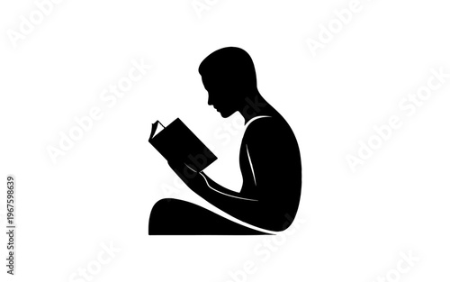 A silhouette of a person absorbed in reading a book.