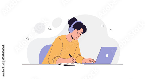 Student learning online with headphones and laptop, taking notes