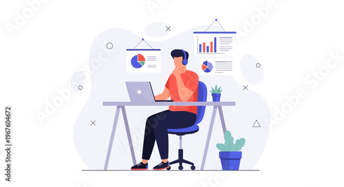 Man working on laptop at desk with charts and graphs, remote work concept