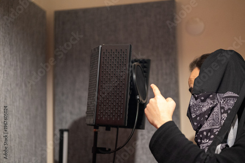 Rapper Recording Track on Microphone in Studio