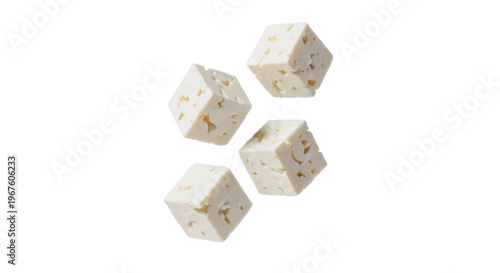 Four cubes of feta cheese on a transparent background