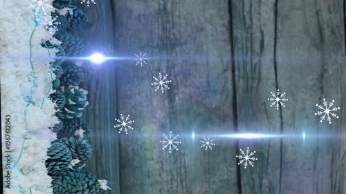 Animation of light moving over pine cones on wooden surface