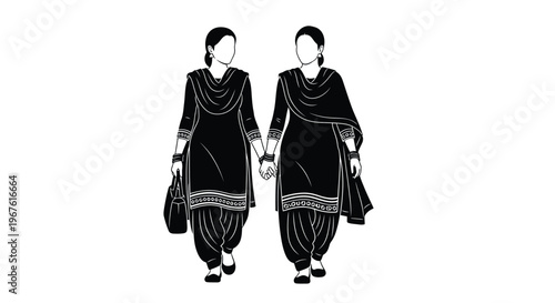 Two women in traditional punjabi salwar kameez holding hands