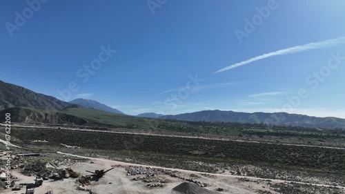  A Man Flying his UAV to survey the local earthquake faults looking at the San Andreas Fault Area near the Seven Oaks Dam 
